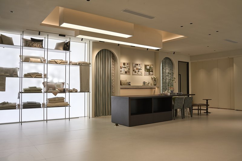 Whole-house custom showroom with cabinetry shelving and dining furniture