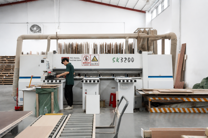 Furniture Operator working at an industrial furniture edge banding machine