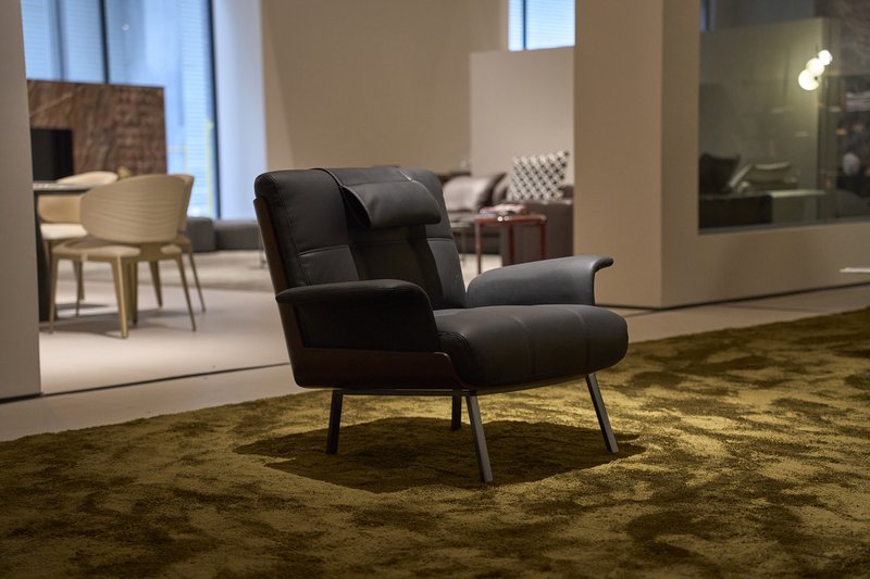 Black lounge chair displayed in a contemporary furniture showroom