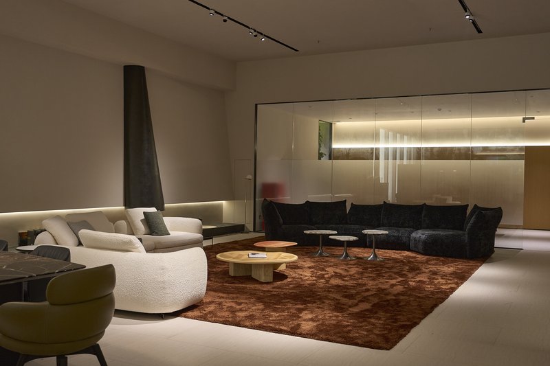 Modern living room furniture display with sofas and coffee tables