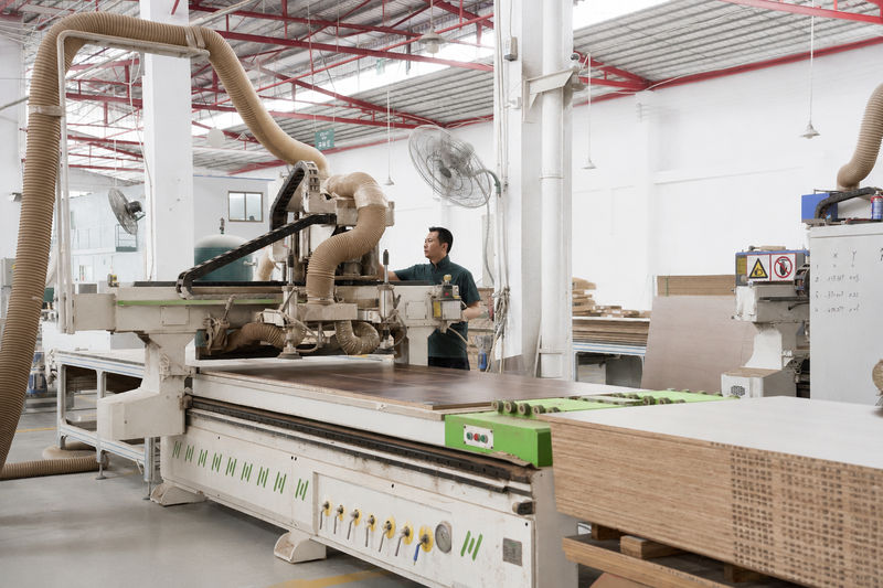 Furniture Robotic furniture panel machining station in operation