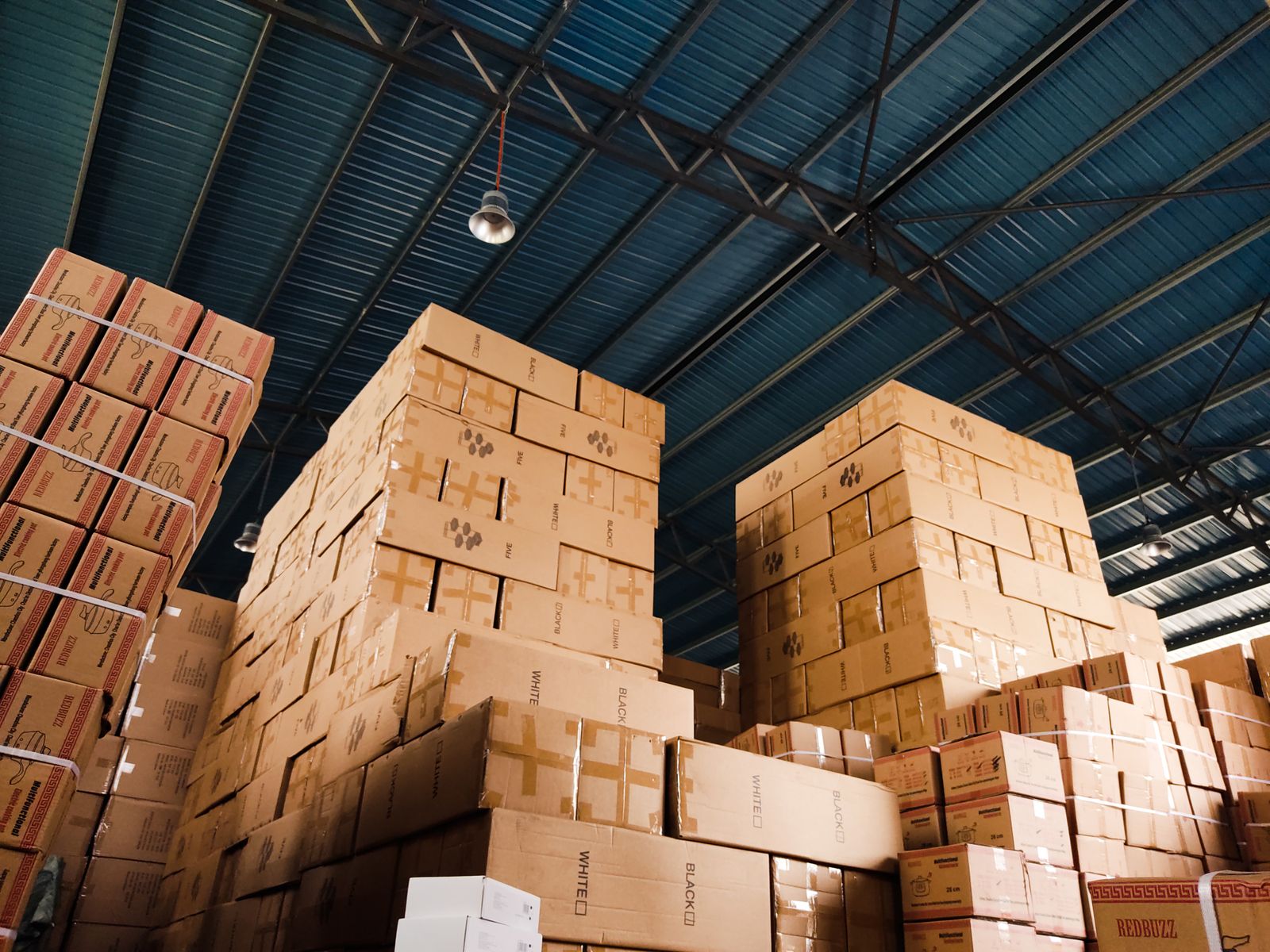 Zichuan Home Stacks of cardboard boxes ready for storage and shipping