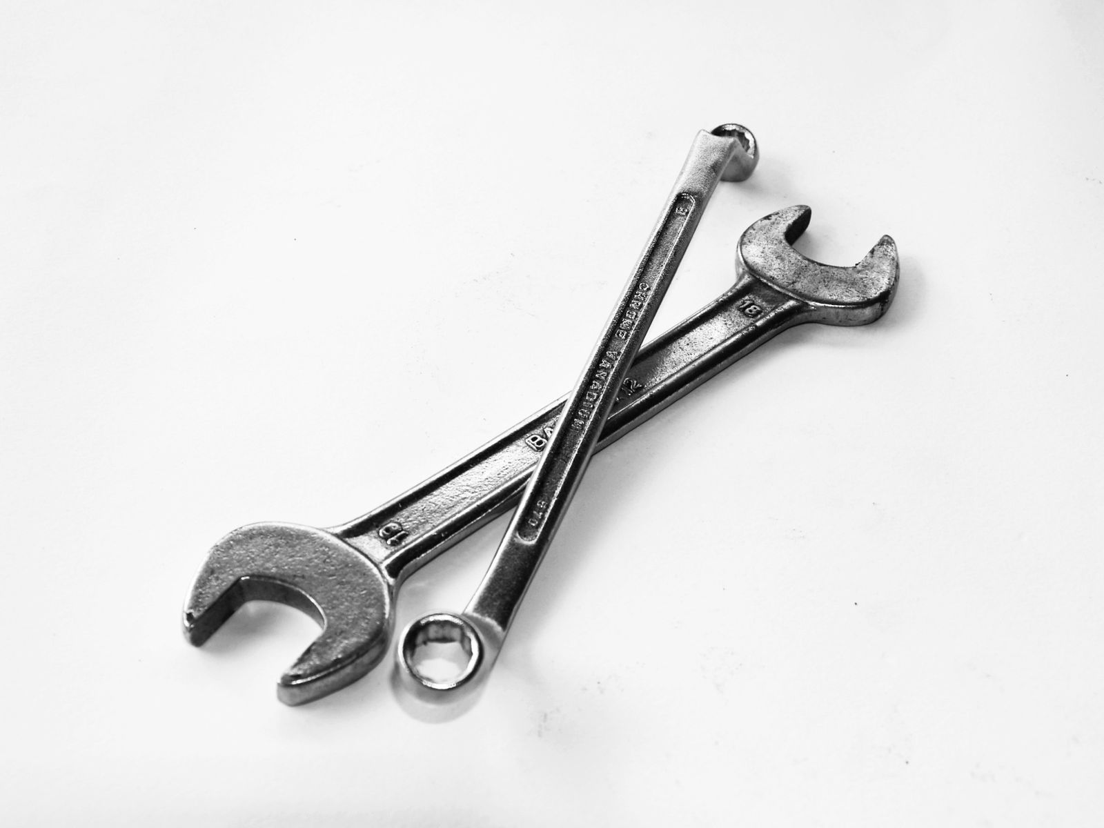 Workers operating equipment in a factory workshop