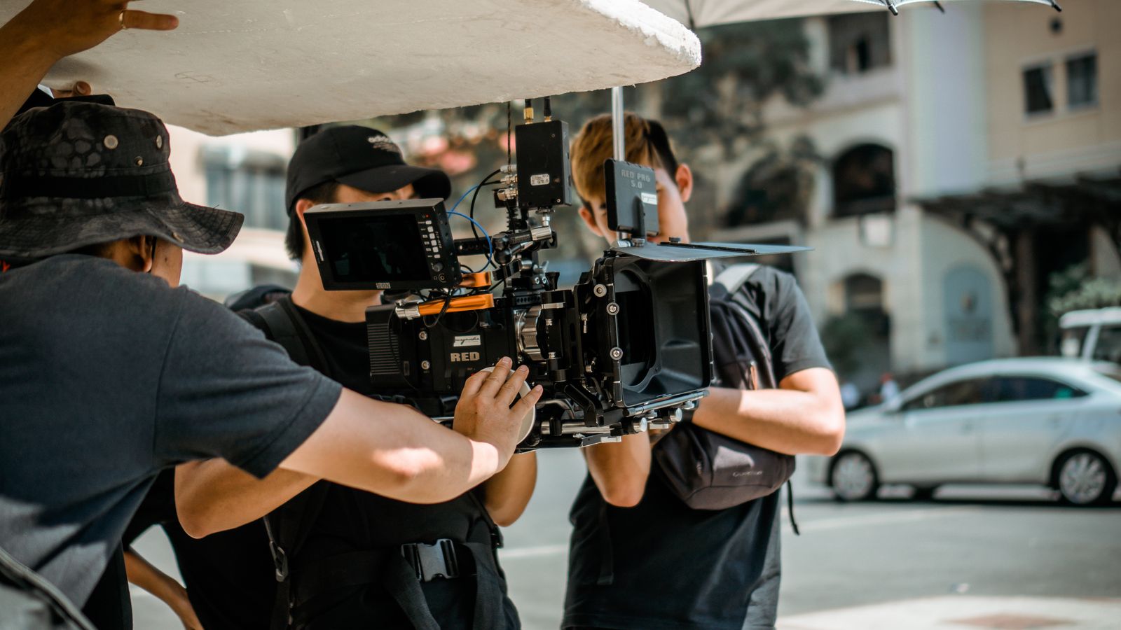 Film crew shooting video with a professional camera