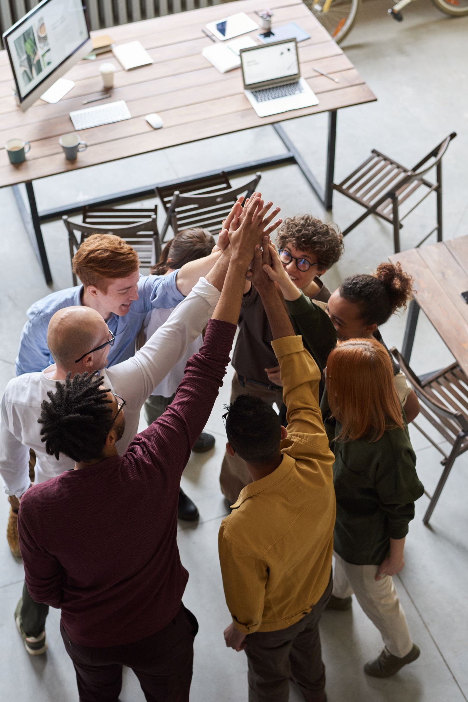 Colleagues working together at a shared desk