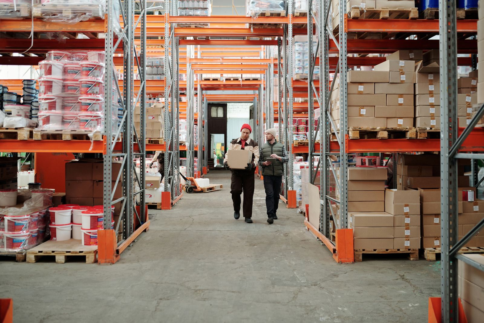 Workers packing and preparing goods for shipment in a warehouse