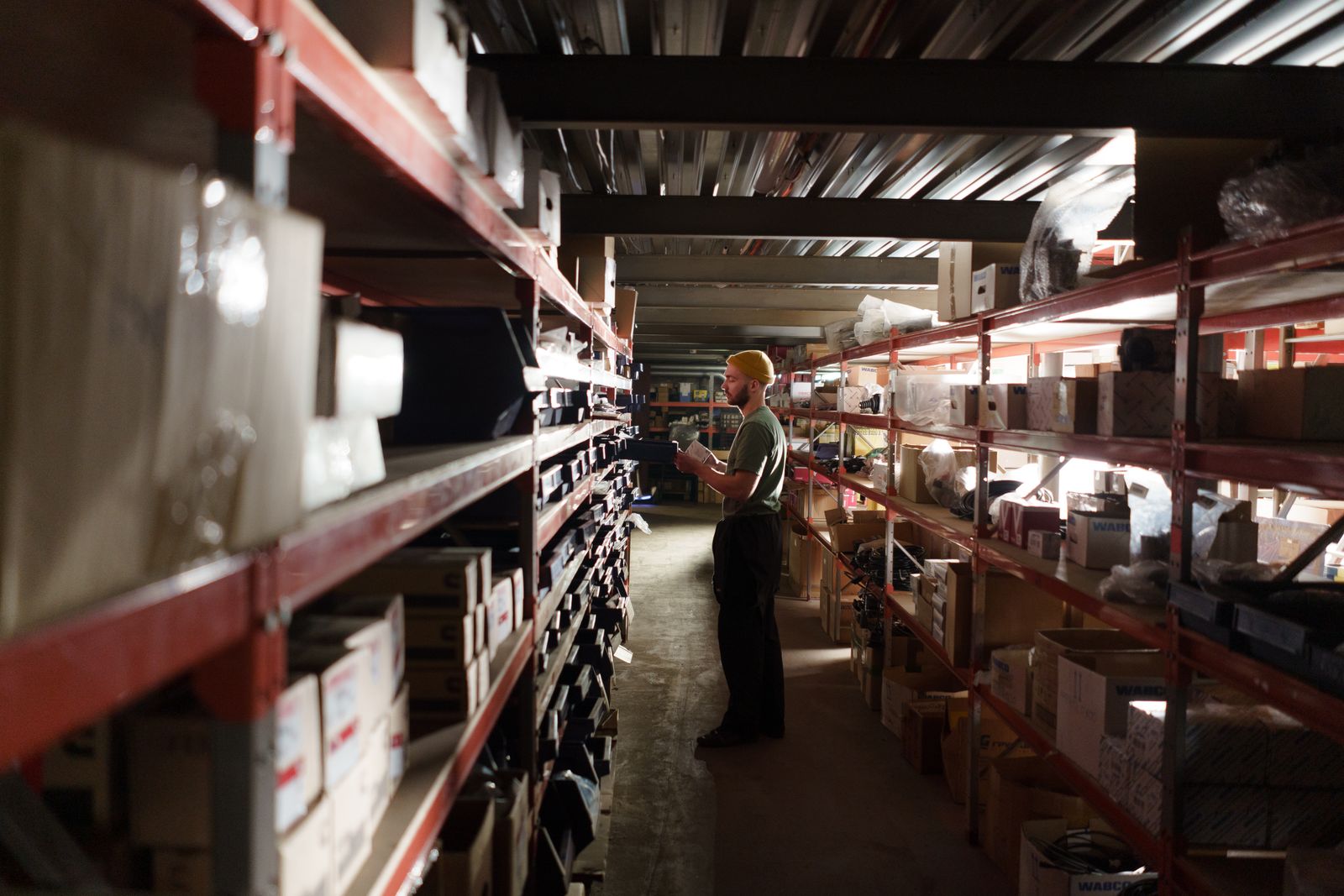 Zichuan Home Inspector checking product quality on a warehouse workbench