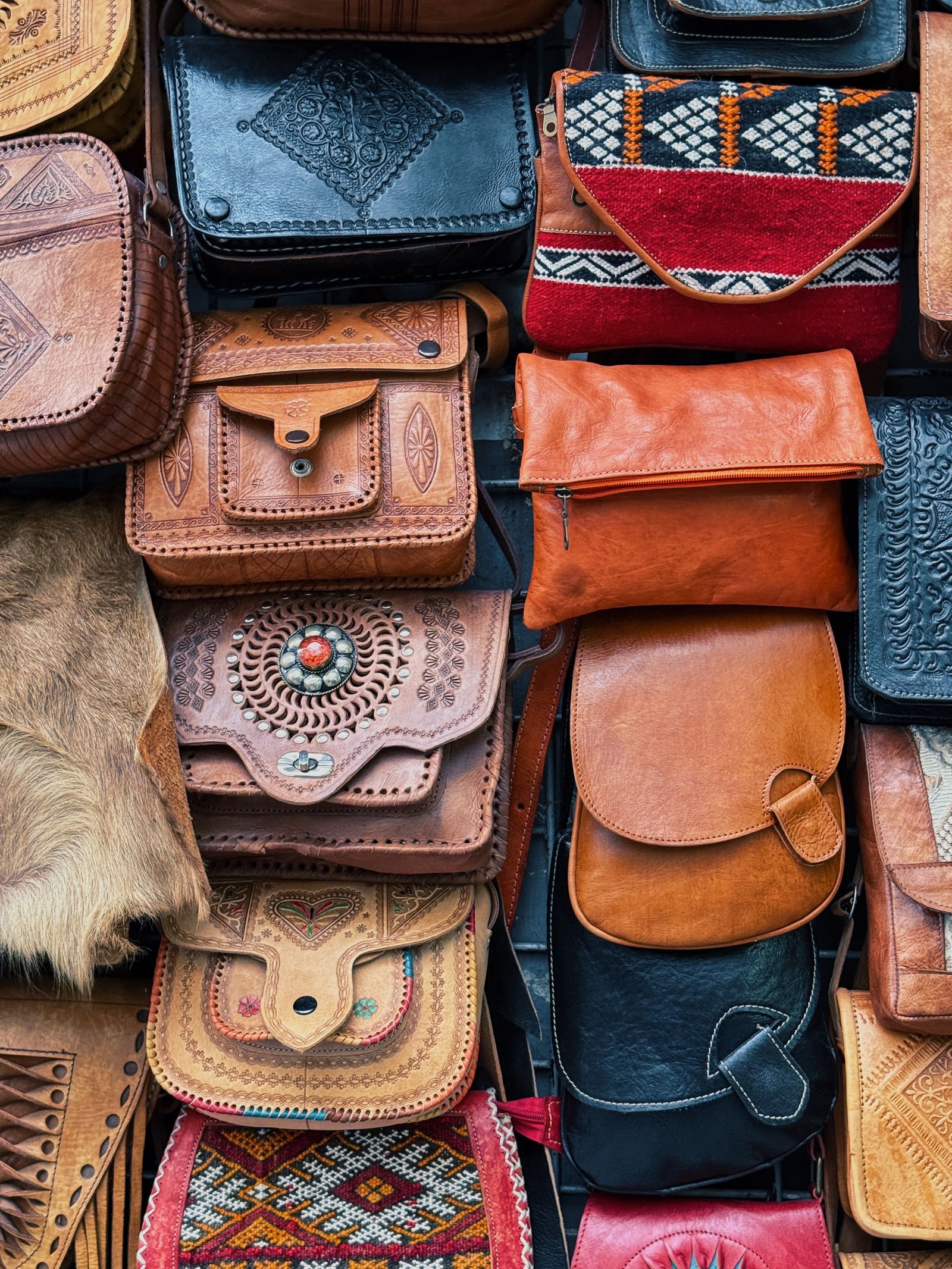 Collection of patterned leather bags on display