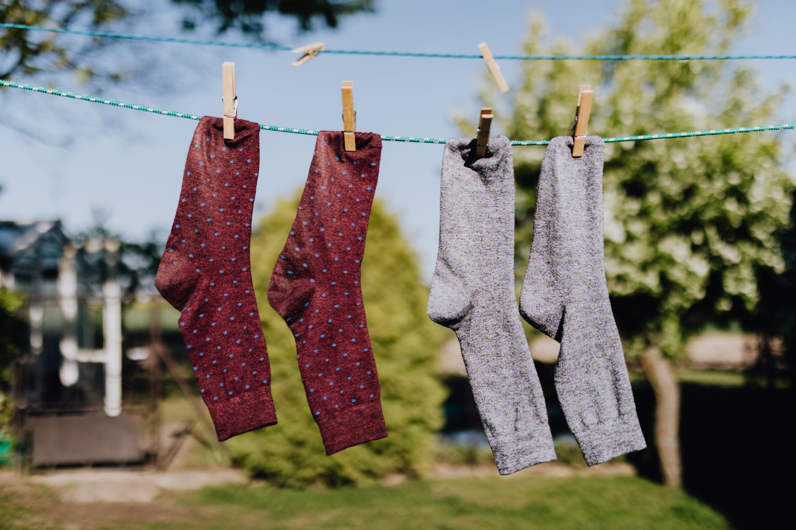 Colorful socks hanging on a clothesline for product display