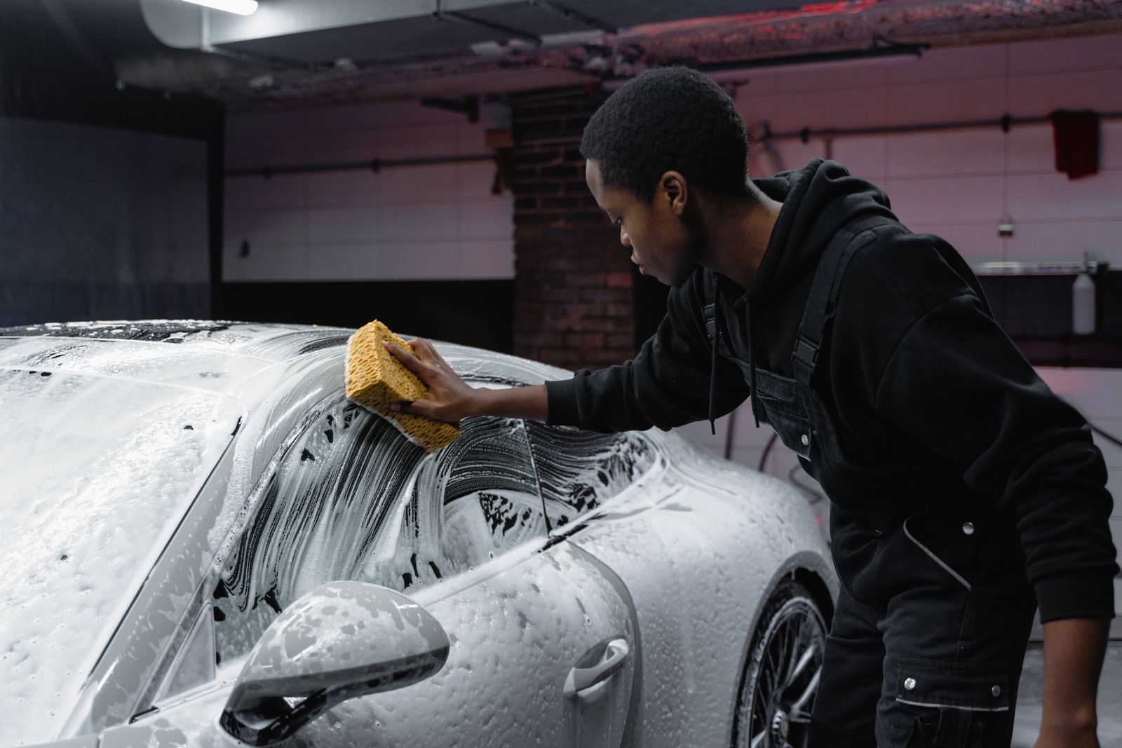 Car detailing and pressure washing in action