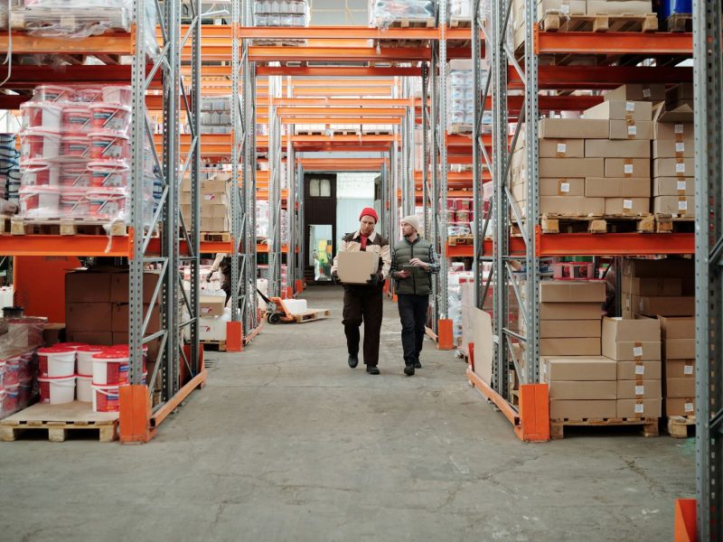 Workers packing and preparing goods for shipment in a warehouse